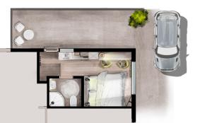 una disposizione a pavimento di una camera con auto di The Little Annex a Horsham