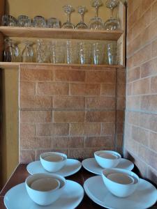 a group of bowls and plates on a table at Casa de descanso Villa Serena in Grecia