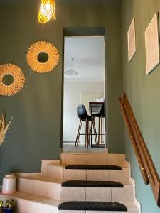 a hallway with stairs and a mirror and a table at "Ferienwohnung Naturliebe - grünes Paradies im Zentrum in Luckenwalde