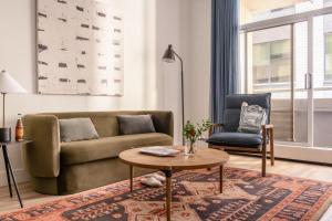 a living room with a couch and a chair at Sonder Rideau in Ottawa