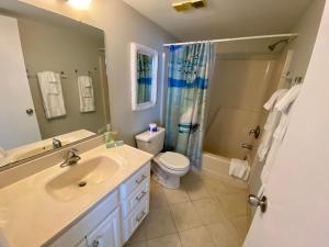 a bathroom with a sink and a toilet and a shower at EBT 302b in Fort Myers Beach