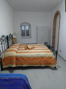 Een bed of bedden in een kamer bij Dimora del Malconsiglio