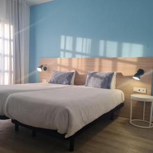 Postel nebo postele na pokoji v ubytování Flag Hotel Santarém