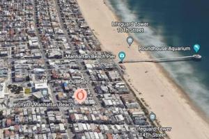 an aerial view of a beach and the ocean at Downtown Manhattan Beach 3 Bed Townhouse Parking in Manhattan Beach