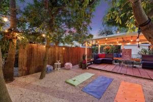 a backyard with two yoga mats and a fence at The New Yorker Miami Hotel in Miami