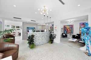 a living room with a bar in the middle at The New Yorker Miami Hotel in Miami