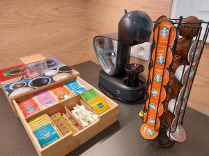 a table with a blender and a box of items at 6bits Apartments in Jeseník