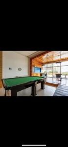 a room with a pool table in a house at Apartamento premium - Df plaza in Brasilia