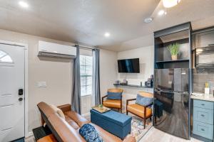 a living room with a couch and a kitchen at Welcoming Sacramento Home Less Than 5 Mi to Downtown! in Sacramento