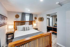 a bedroom with a large bed with a wooden frame at Welcoming Sacramento Home Less Than 5 Mi to Downtown! in Sacramento