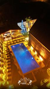 an overhead view of a swimming pool at night at Şile SHAMAN BUNGALOW VİLLAS 102 in Şile