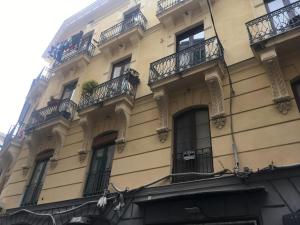 a building with balconies on the side of it at L'Incanto House in Salerno