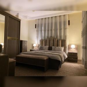En eller flere senge i et værelse på Jerash Heart