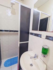 a bathroom with a sink and a shower at Solar Hostel Beach Copacabana in Rio de Janeiro