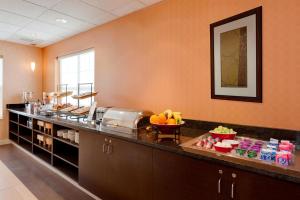 a kitchen with a counter with a bowl of fruit on it at Residence Inn Merrillville in Merrillville