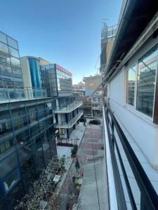 a view of a city street from a building at Tony 's place in Drama