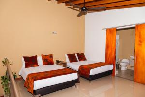 Postel nebo postele na pokoji v ubytování Hotel Laureles Loft