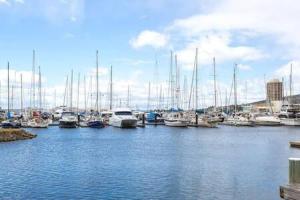 a bunch of boats docked in a harbor at Cosy renovated 2 bed villa in superb location in Hobart