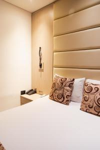 Postel nebo postele na pokoji v ubytování Hotel Laureles Loft