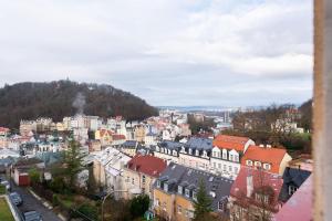 a view of a city with buildings and trees at Laland Apartment in Karlovy Vary