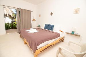 Postel nebo postele na pokoji v ubytování Hotel Encanto Holbox Beach Front
