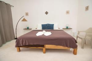 Postel nebo postele na pokoji v ubytování Hotel Encanto Holbox Beach Front