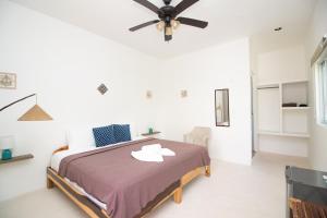 Postel nebo postele na pokoji v ubytování Hotel Encanto Holbox Beach Front