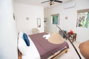 Postel nebo postele na pokoji v ubytování Hotel Encanto Holbox Beach Front