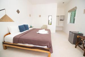 Postel nebo postele na pokoji v ubytování Hotel Encanto Holbox Beach Front