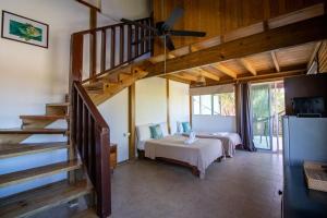 Postel nebo postele na pokoji v ubytování Hotel Encanto Holbox Beach Front