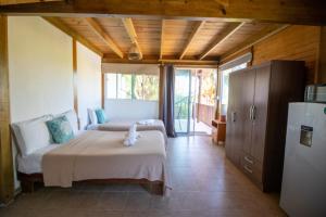 Postel nebo postele na pokoji v ubytování Hotel Encanto Holbox Beach Front