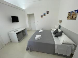 Postel nebo postele na pokoji v ubytování Casa Crispi