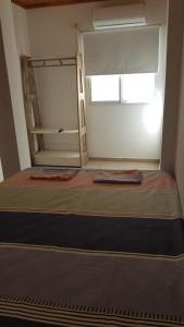 A bed or beds in a room at Diamelita