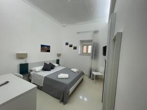 Postel nebo postele na pokoji v ubytování Casa Crispi