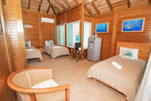 Postel nebo postele na pokoji v ubytování Hotel Encanto Holbox Beach Front