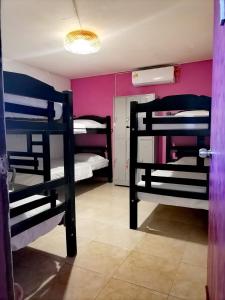 Postel nebo postele na pokoji v ubytování Hostel Shalom Adonai