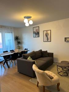 Area tempat duduk di Agréable 3 pièces avec Parking à La Courneuve Gare by immo Kit bnb