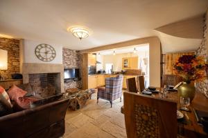 a living room with a couch and a fireplace at The Bolt Hole in Morecambe