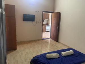 a bedroom with a bed with two pillows on it at CASAFUERTE departamentos in Luque