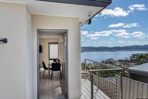 a balcony of a house with a view of the water at The View Studio Apartment Fully self-contained Sandy Bay in Sandy Bay