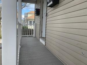 a walkway leading to a door on a house at Charming Urban Apartment Getaway in Providence