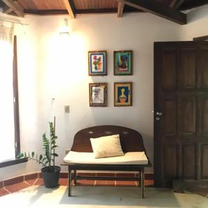 a bed sitting in a room next to a door at Dellacasa in Jericoacoara