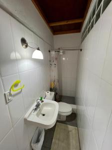 a bathroom with a sink and a toilet at Casa Naturaleza in Valle de Anton