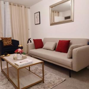 a living room with a couch and a table at Impeccable 2-Bed House in Coventry in Coventry