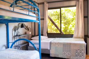 Voodi või voodid majutusasutuse Coyote Rooms toas