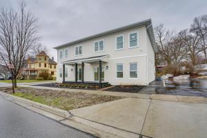 a white house on the side of a street at St Clair Apartment - Walk to River and Boardwalk! in Marysville