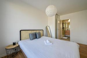 Ліжко або ліжка в номері Le Cosy Paddock - Balcon - Proche Gare