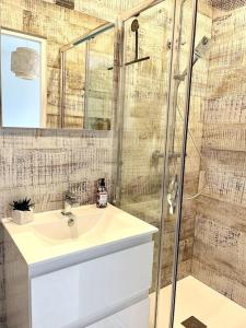 a bathroom with a sink and a shower at Maison des Artistes de Barbizon in Barbizon +27 photos