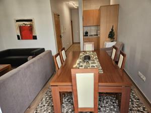 a living room with a table and a couch at Apart Nel in Praia +9 photos