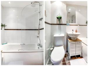 a bathroom with a tub and a toilet and a sink at Entire 2 Bed Flat Contractors Families and Relocators in Ware +8 photos